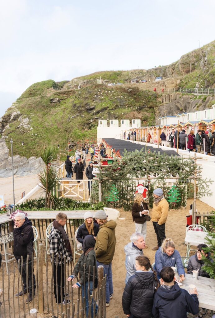 Visitors browsing stalls at the Beach hut Christmas Market